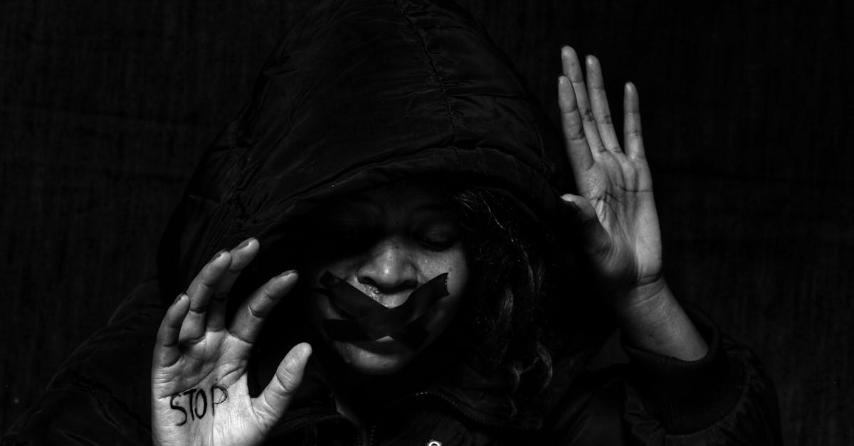 Powerful black and white image highlighting women’s rights and abuse prevention.